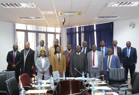 ActionAid staff posing with Members of Parliament