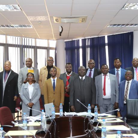 ActionAid staff posing with Members of Parliament